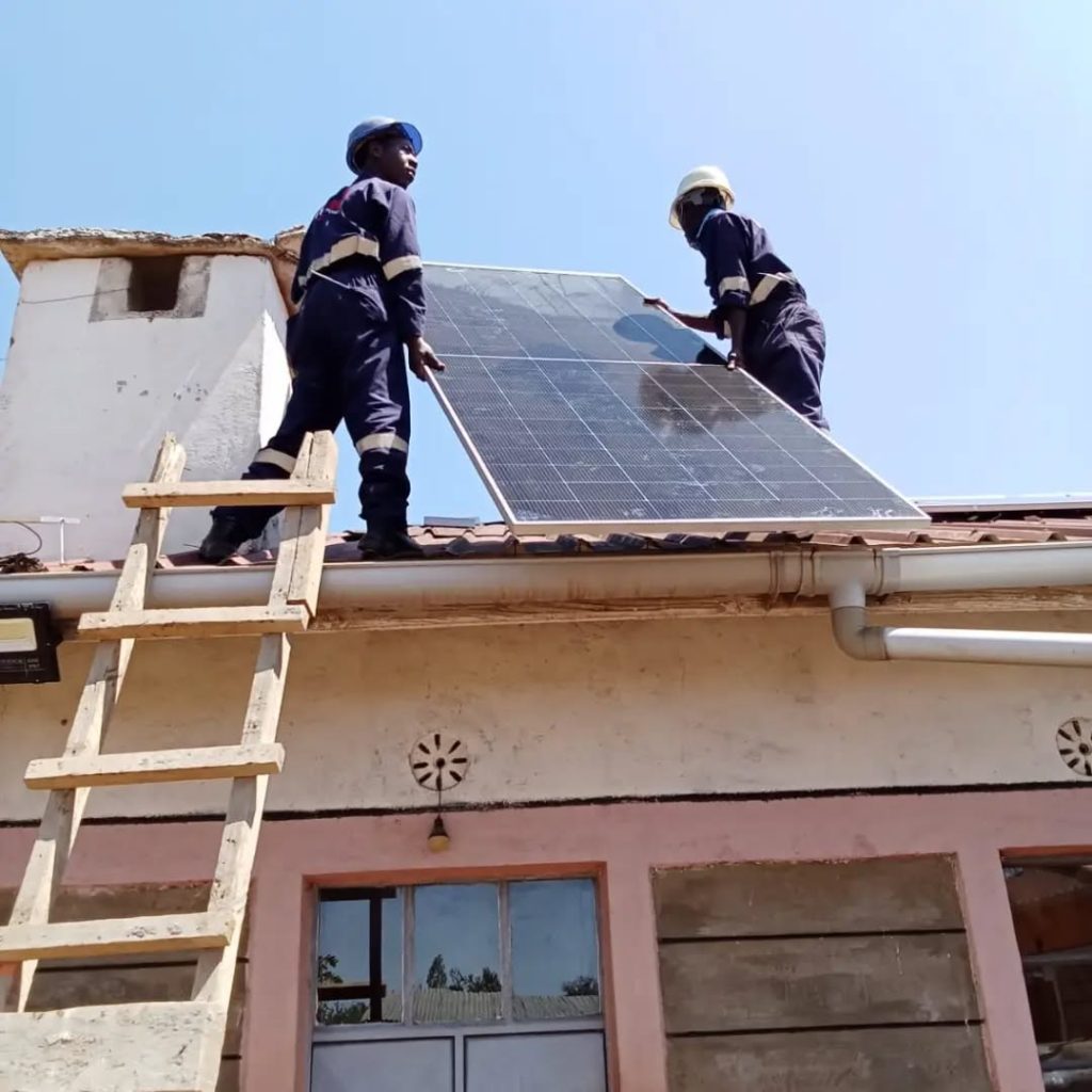 Delta Power Links team installing a solar panel in Mutanda, Kitui